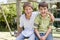 Two young male friends at a playground smiling