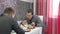 Two Young Men Eating Breakfast Kitchen Together - cooking, food and home concept lunch two friends lifestyle men indoors