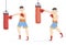 Two young men - experienced boxer and the beginner working out on punch bags in a gym in a health and fitness and