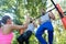 Two young men repeating pull-up exercise during upper-body routine