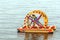 two young men sail on an inflatable catamaran with a large wheel propeller along the Volga River