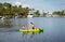 Two young people paddling a kayak