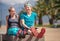 Two young people rest together on the bench after jogging