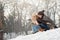 Two young people sliding on a sled