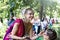 Two young pretty girls in Hindu national costumes in a summer Park