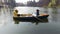 Two young pretty girls sitting in the small boat in the middle of beautiful reflective lake or river. Active lifestyle