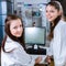 Two young researchers carrying out experiments in a lab