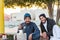 Two young Saudi Arabian men sitting at the beach of corniche park, Dammam, Saudi Arabia