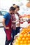 Two young sellers doing inventory in health grocery shop.