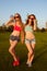 Two young sexy girls with shapely, toned body in the park