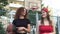 Two young sports women teenagers with a basketball ball outdoors