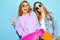 Two young stylish woman models in summer hipster clothes