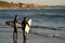 Two young surfers at Swami`s beach in Encinitas California