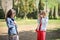 Two young tourist women taking photographs outdoors