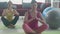 Two young woman doing yoga with meditating on mat together at home, female pose with lotus at fitness.