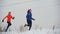 Two young woman running technically in winter outdoor