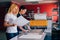 Two young woman working in printing factory