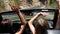 Two young woman in yellow car enjoying vacation