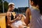 Two young women, athletic friends, sitting