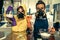 Two young women chemists working at scientific laboratory with drugs