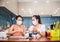 Two young women cooking the tapioca dumpling in quarantine for wearing protective mask