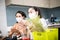 Two young women cooking the tapioca dumpling in quarantine for wearing protective mask