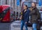 Two young women cross the street in London