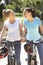 Two Young Women On Cycle Ride Together