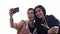 Two young women different nationalities close friends taking a selfie