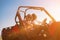 Two young women driving a off road buggy car