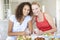 Two Young Women Enjoying Meal Together