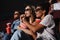 Two young women in eyeglasses watching 3d movie