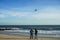 Two young women flying kite at Atlantic beach