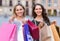 Two young women holding shopping bags