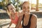 Two young women in sportswear laughing after an outdoor workout