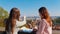 Two young women standing on observation deck and looking the right path. Czech, Prague