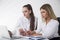 Two young women at a table