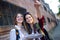 Two young women tourist using their map in the city.