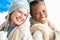 Two Young Women Wearing Winter Clothes In Studio