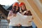 Two young women workers on the roof