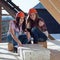 Two young women workers on the roof