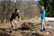 Two young women working the land on an idyllic farm