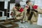 Two young workers assembling furniture in the factory