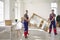 Two young workers from truck delivery service removing furniture from house or apartment