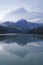 Txindoki with snow. Mount Txindoki reflected in the Ibiur reservoir, Basque Country