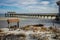 Tybee Island pier in Southern Georgia United States on the beach of the Atlantic Ocean, and a swing