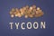 Tycoon written with wooden letters on a blue background