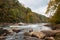 Tygart Valley River surrounded by trees at daylight in the Valley Falls State Park, West Virginia