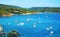 Tyhrrhenian sea, rocks, boats floating in Tuscany, in Elba island, Italy