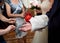 Tying arms of newlywed russian wedding tradition